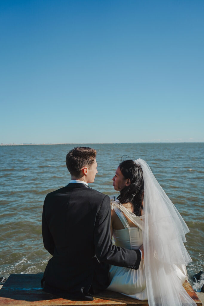 bride and groom overlooking the bay