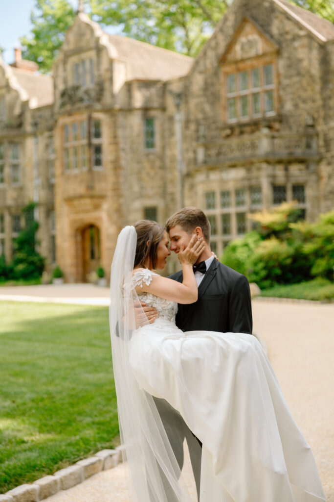 groom carrying bride outdoor wedding