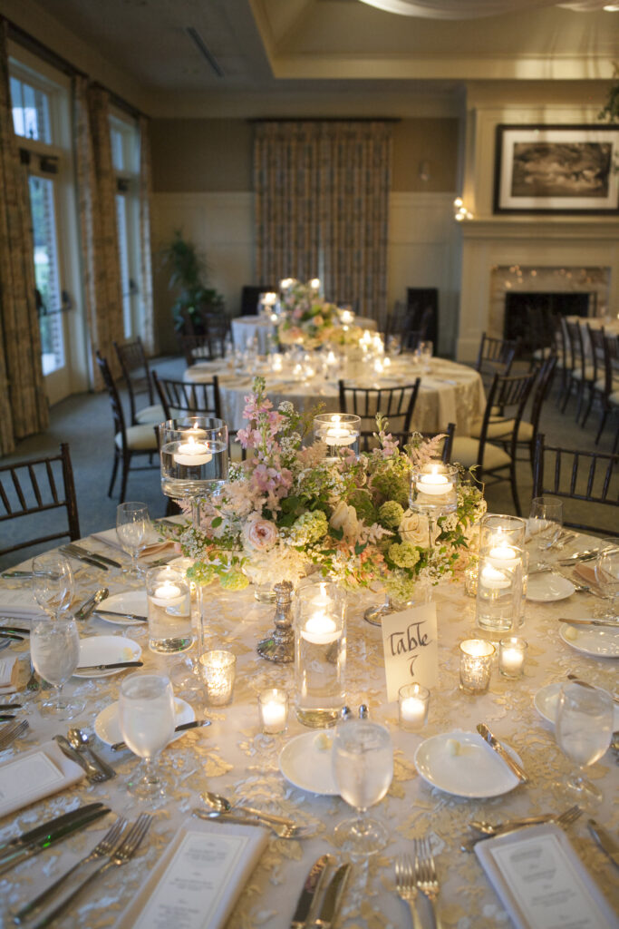 wedding reception table with china and water