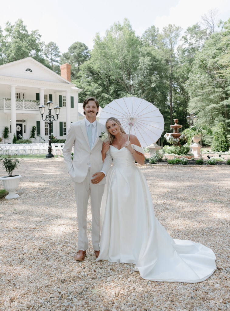 Couples Portraits Magnolia Mansion bride and groom with umbrella