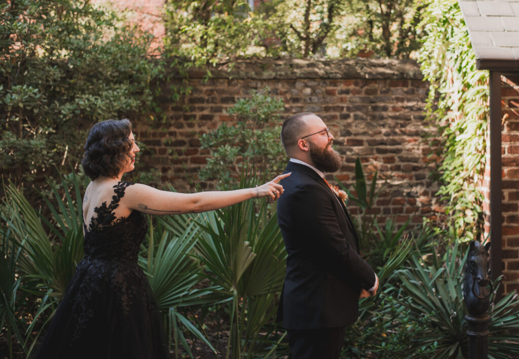 first look - bride in black dress