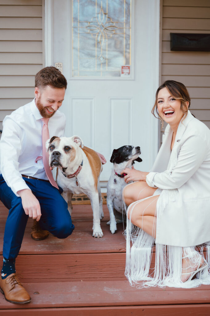 bride and groom with dogs