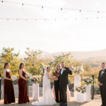 Wedding Party in front of a beautiful outdoor wedding ceremony