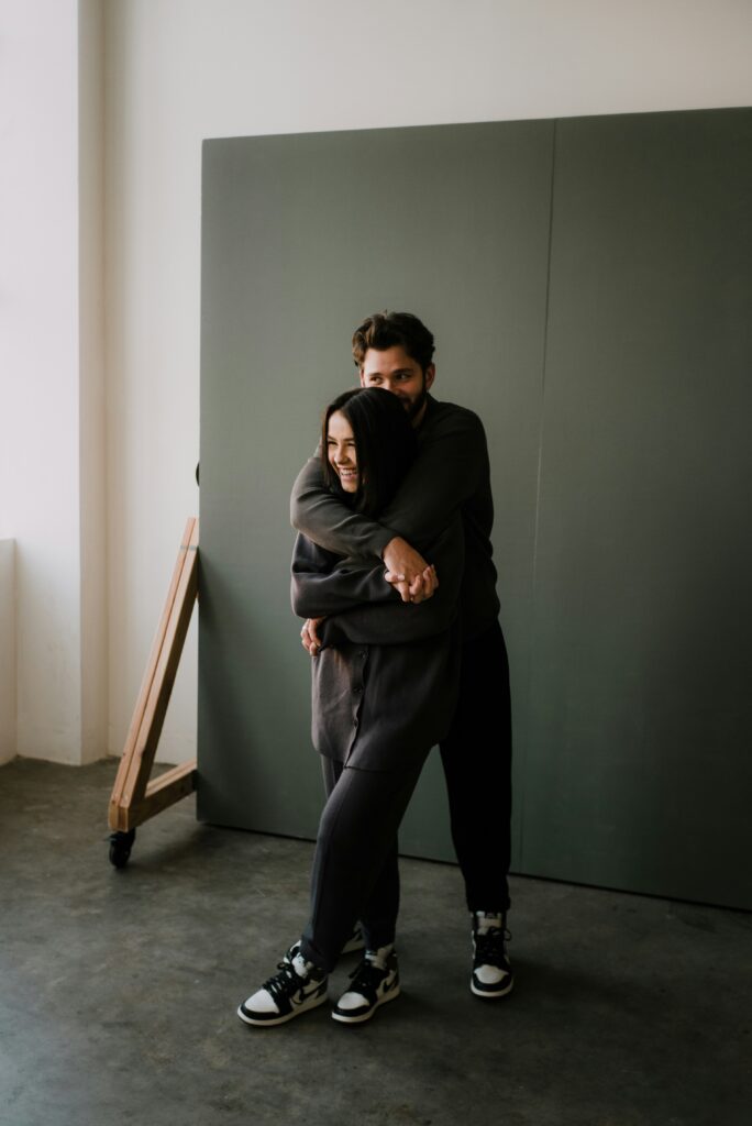 Couple playing at photoshoot