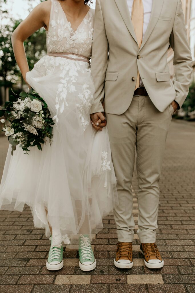 Bride and groom holding bouquet