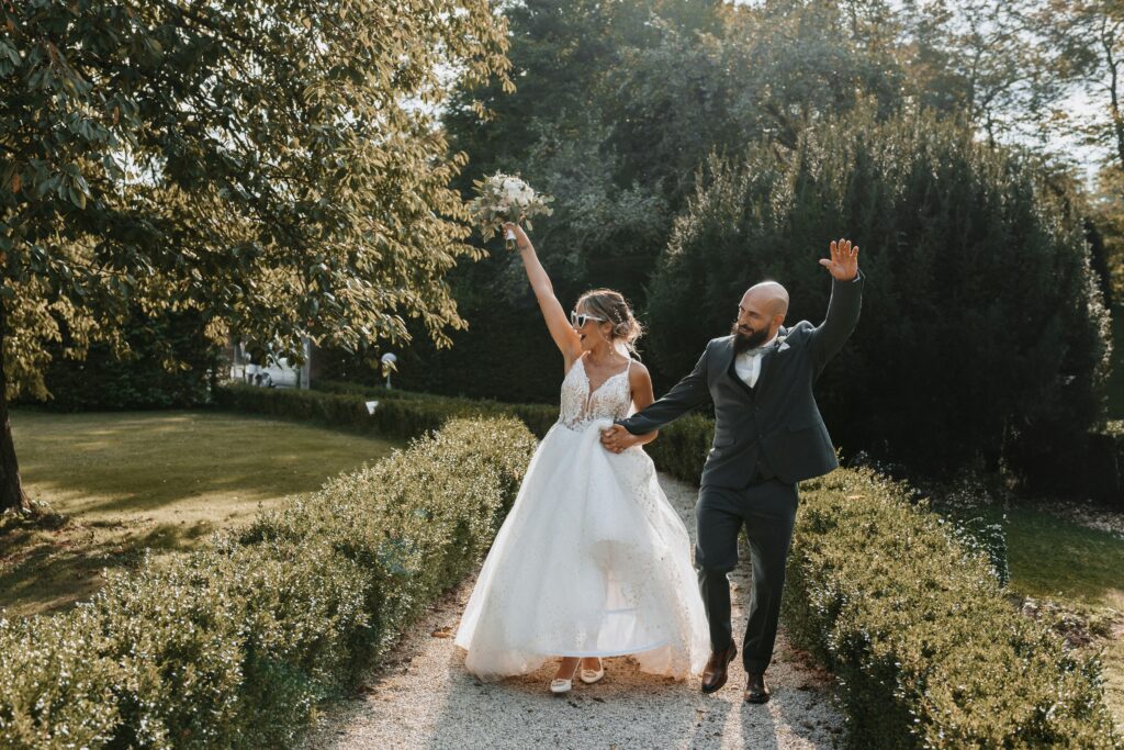 Couple Walking outside of their outdoor wedding venue 
