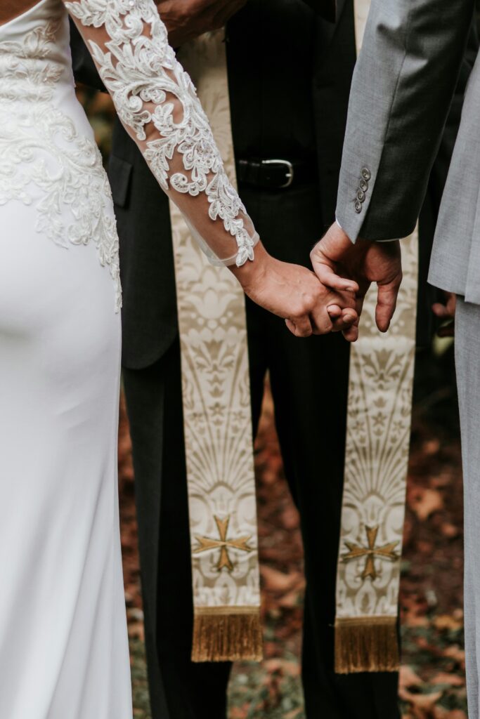 Wedding couple holding hands