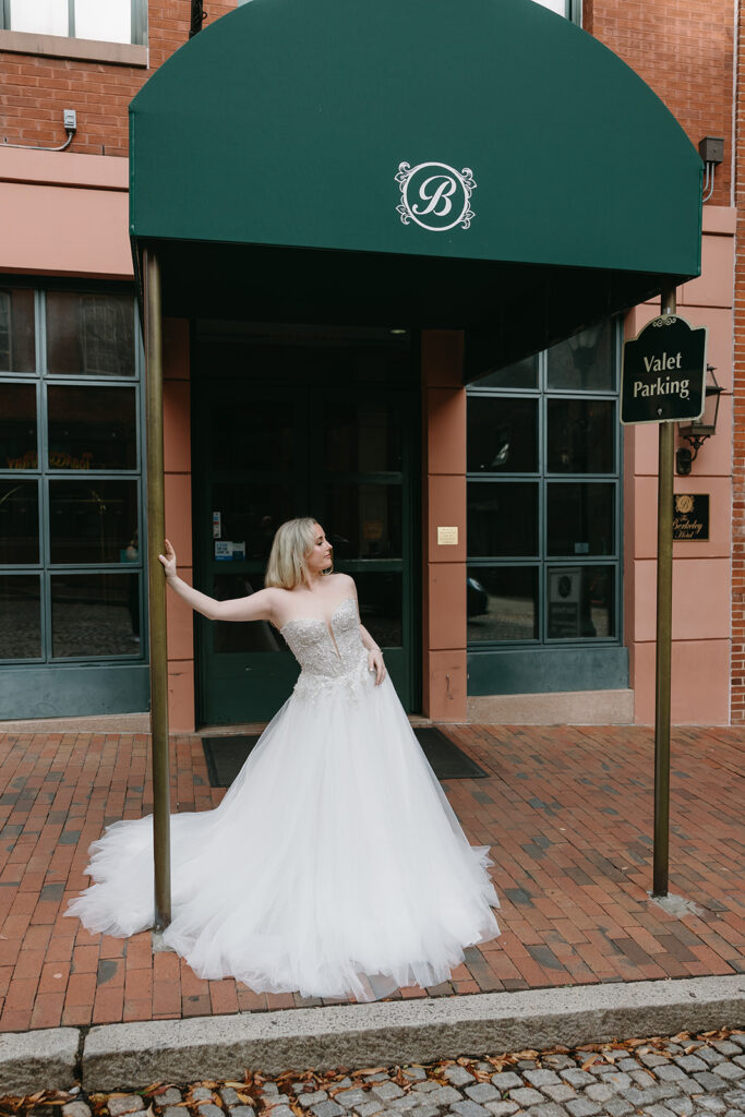 Bride rin front of hotel