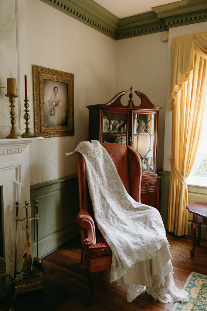 wedding gown draped over a chair