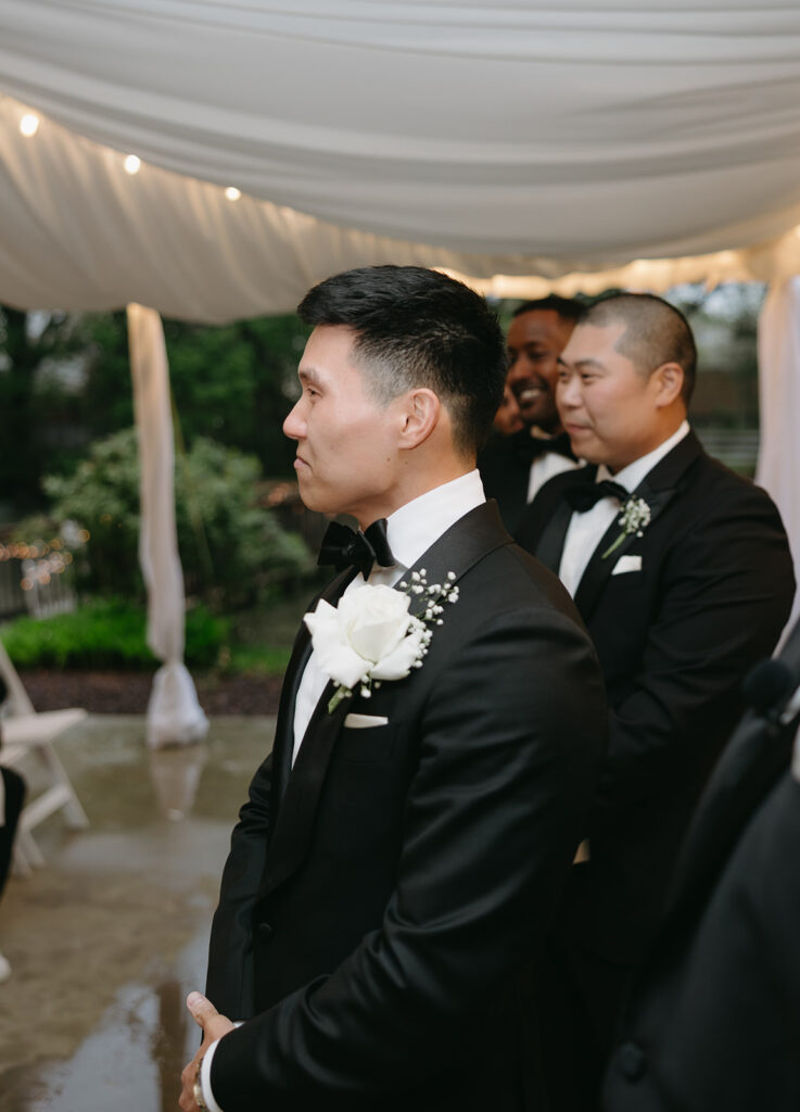 groom seeing his bride walk down the aisle