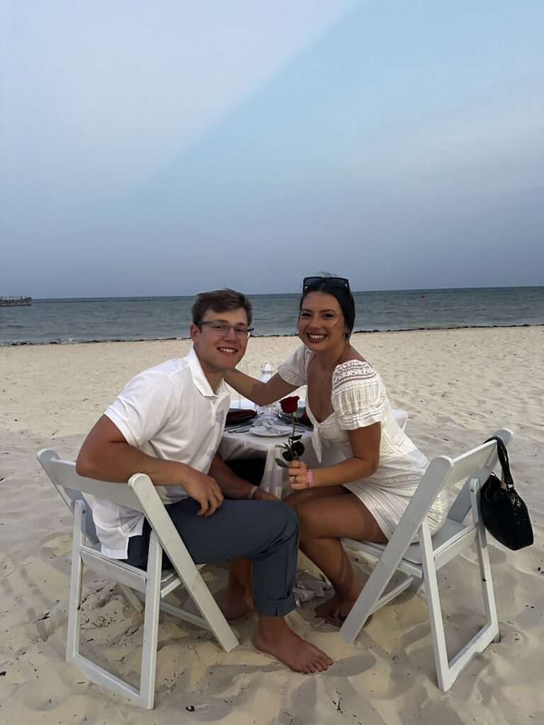 Couple having dinner on the beach