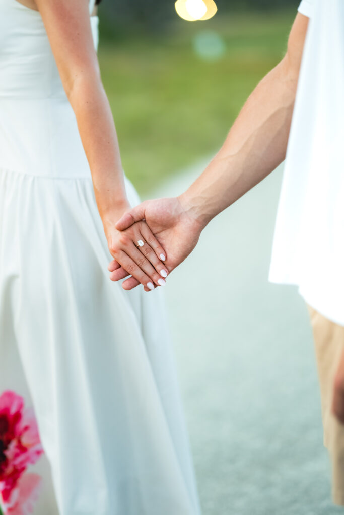 Couple holding hands on beach