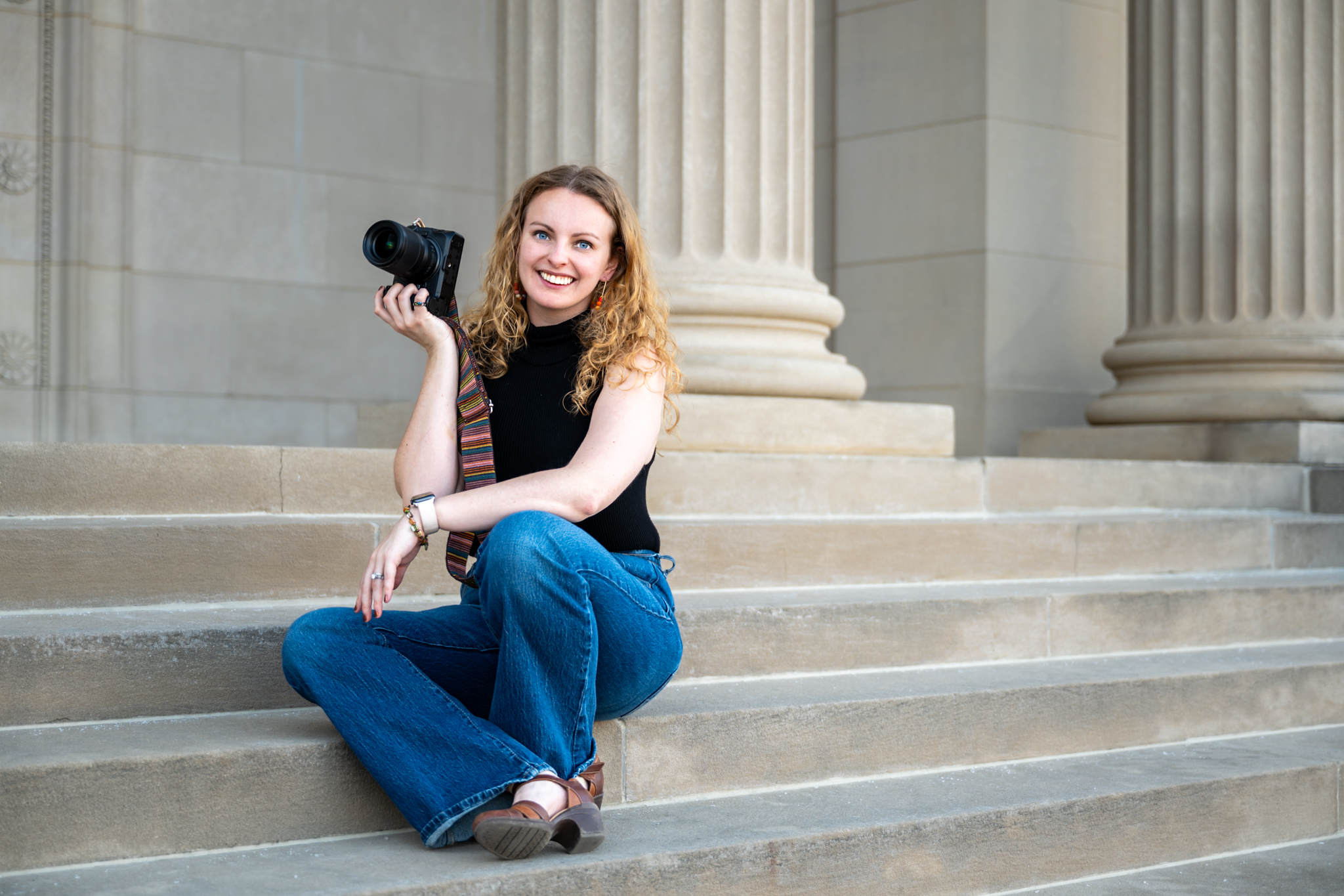 Photographer on steps with camera