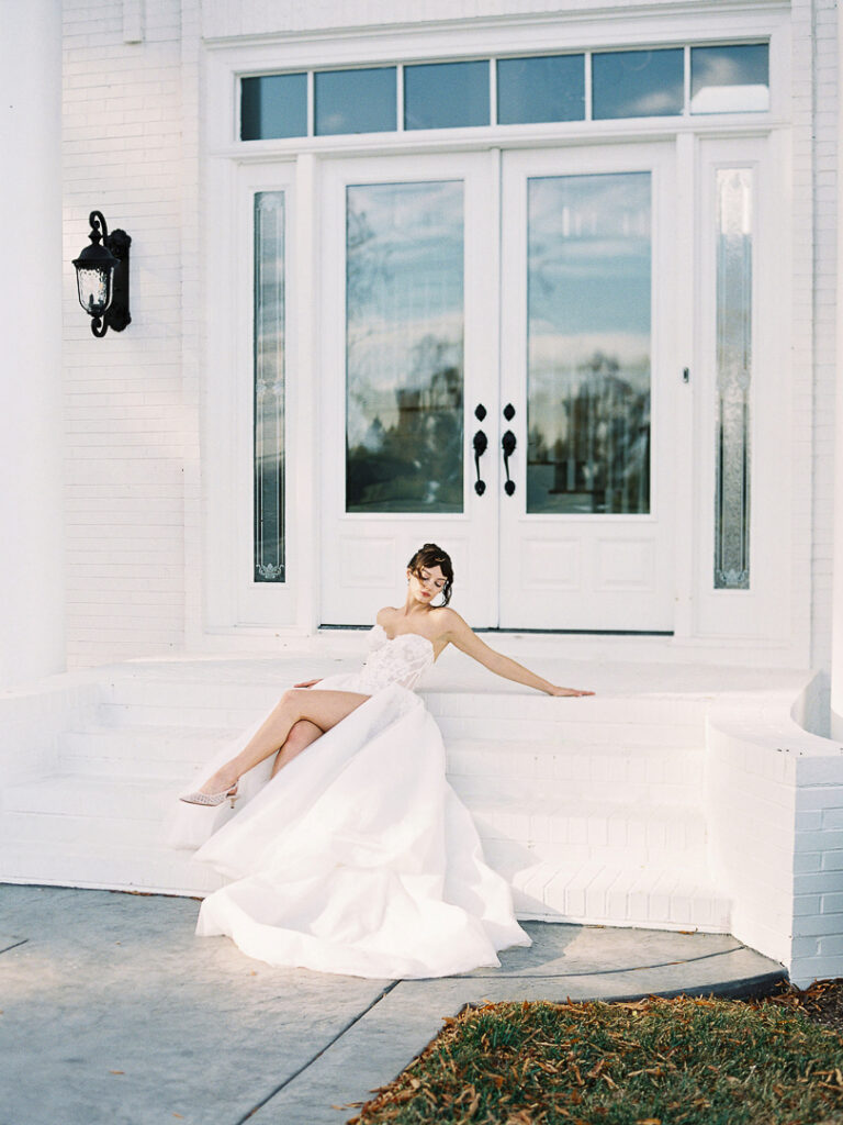 Bride with ballgown laid on stairs