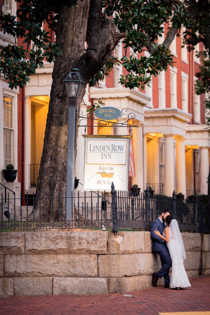 bride and groom in front of linden row inn