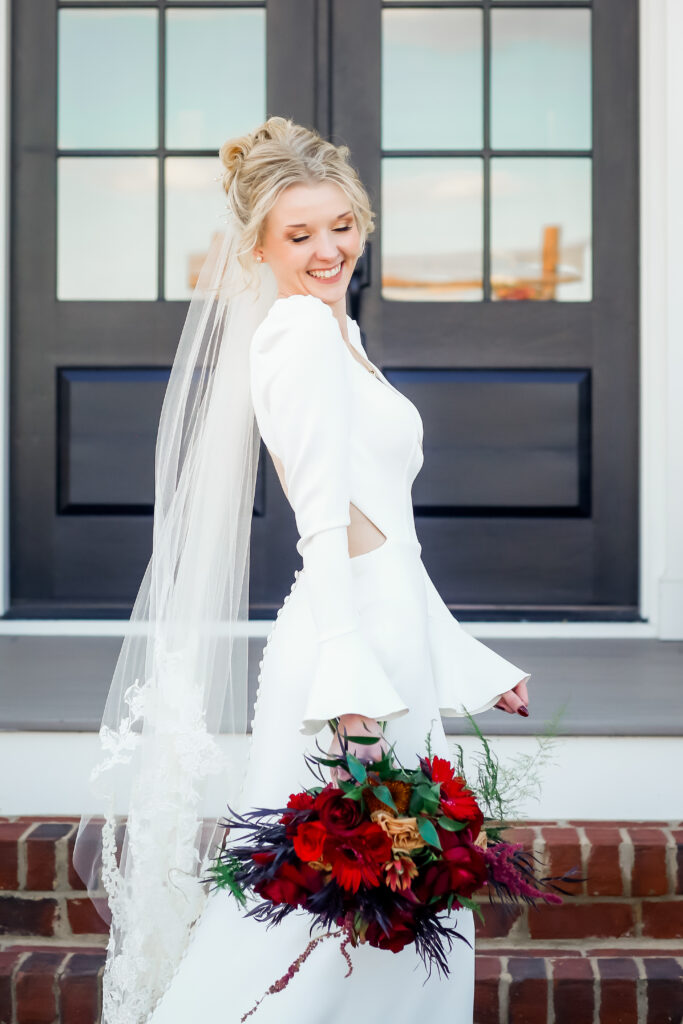 Bride standing with florals