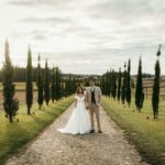 Couple on wedding da standing in road