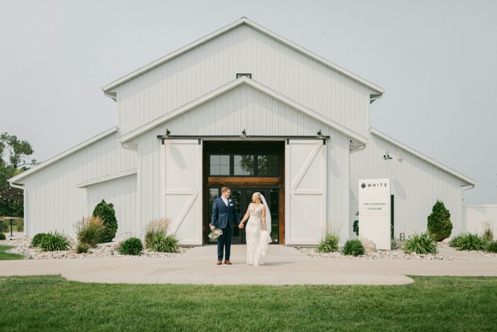 Wedding couple outside of barn